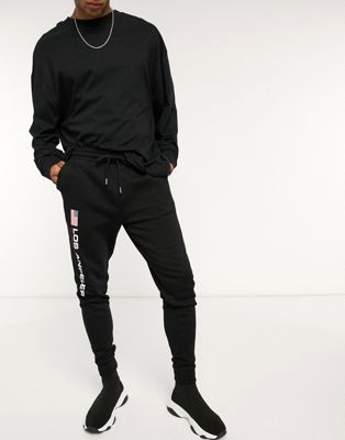 Синие выбеленные джоггеры в стиле oversized с логотипом Puma Plus эксклюзивно для